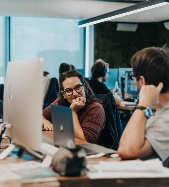 Spooners laughing at office desk